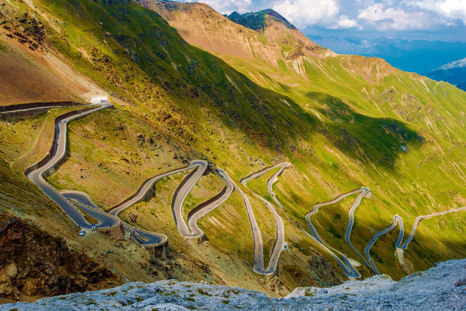 The numbered hairpins of the Stelvio Pass stacked up the mountainside.